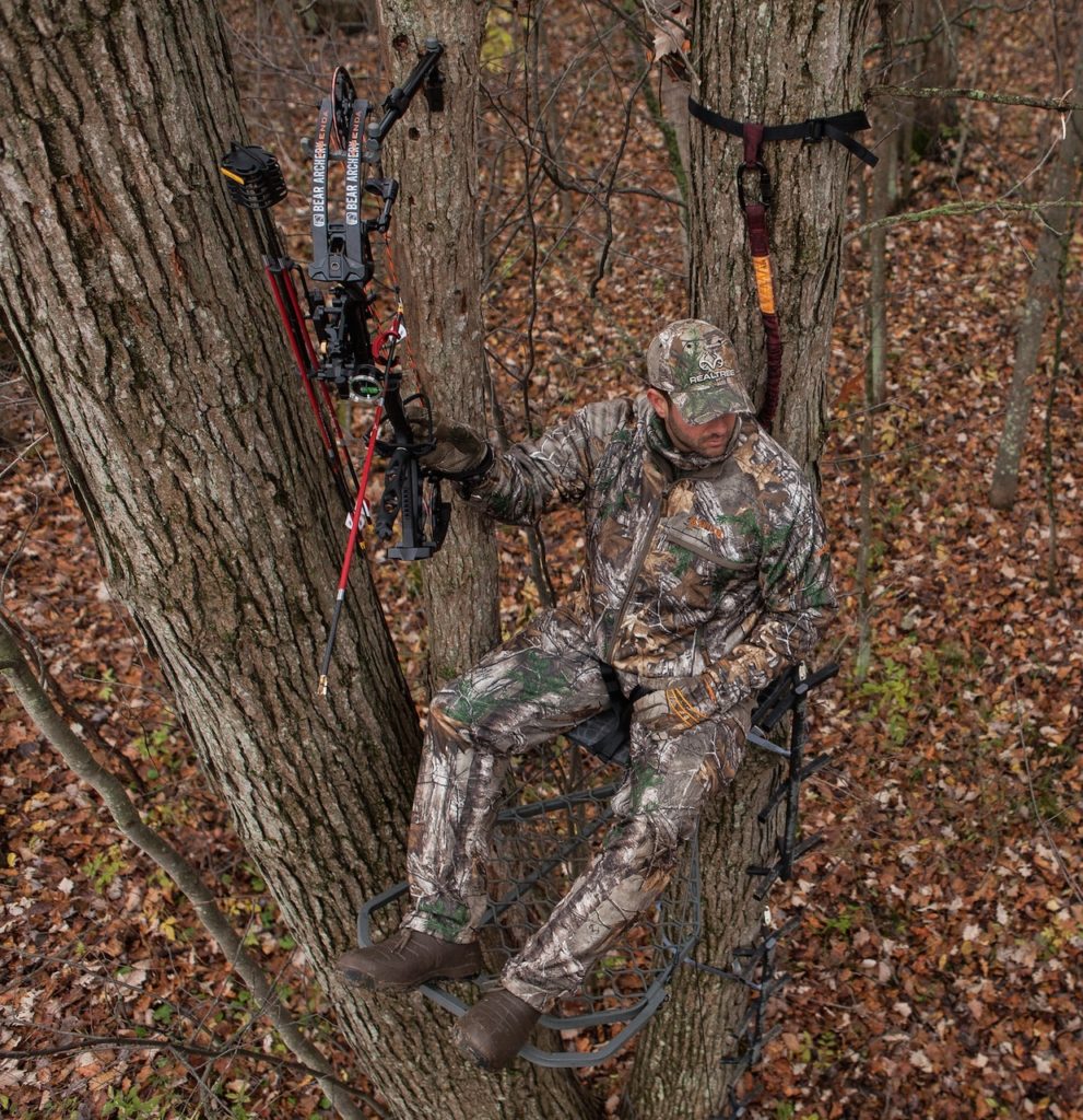 Bow hunting in tree and matching camo