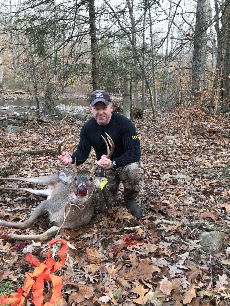 Tagging a mature buck during the rut in PA.